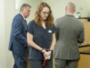 Stephanie McCrea, a former Evergreen High School drama teacher, walks back to a holding area for jail inmates after being sentenced Wednesday to five years in prison.