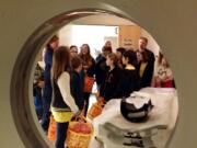 North Garrison Heights: Kids on Vancouver's Junior Joy Team and the Hough Elementary Leadership Team learn about a CT scan machine on a visit Saturday to PeaceHealth Southwest Medical Center, where they thanked hospital workers for their work.