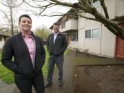 Kris Hanson, left, director of affordable housing for the Vancouver Housing Authority, and Craig Lyons, former director of the Council for the Homeless who now works for Key Property Services Inc., visit the Pinewood Terrace apartments on Kauffman Avenue.