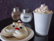 A candy cane mocha and a frosted Santa Claus cookie are served at the Squeeze and Grind in Camas.