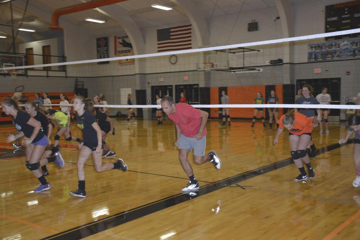 Washougal: New Washougal School District Superintendent Mike Stromme practices with the Washougal High School volleyball team.