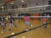 Washougal: New Washougal School District Superintendent Mike Stromme practices with the Washougal High School volleyball team.