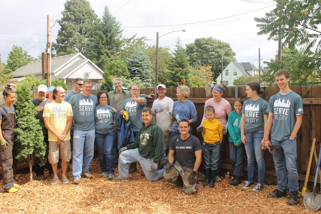 Esther Short: Volunteers from Abundance Life Church participating in the Serve The City party, where volunteers gave back to the community by doing yard work and helping those in need.