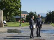 Dan Bernardo, left, who just took over as interim president of Washington State University, looks over views from the center of campus at Washington State University Vancouver with WSUV chancellor Mel Netzhammer III on Thursday morning, Sept. 10, 2015.