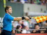 MLS Assistant Referee Jeremy Hanson of Vancouver works the sideline at the Portland Timbers' match against the Chicago Fire Friday Aug. 7th at Providence Park.