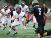 Camas player Jared Bentley runs with the ball during a game against Evergreen at McKenzie Stadium on Friday.