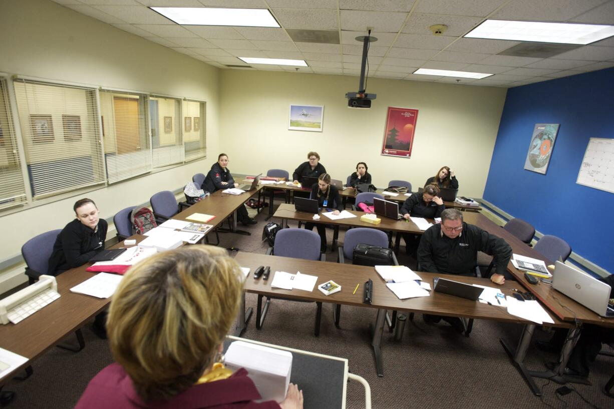 Carola Case teaches students in the hotel and restaurant event management class at the International Air and Hospitality Academy in Vancouver.