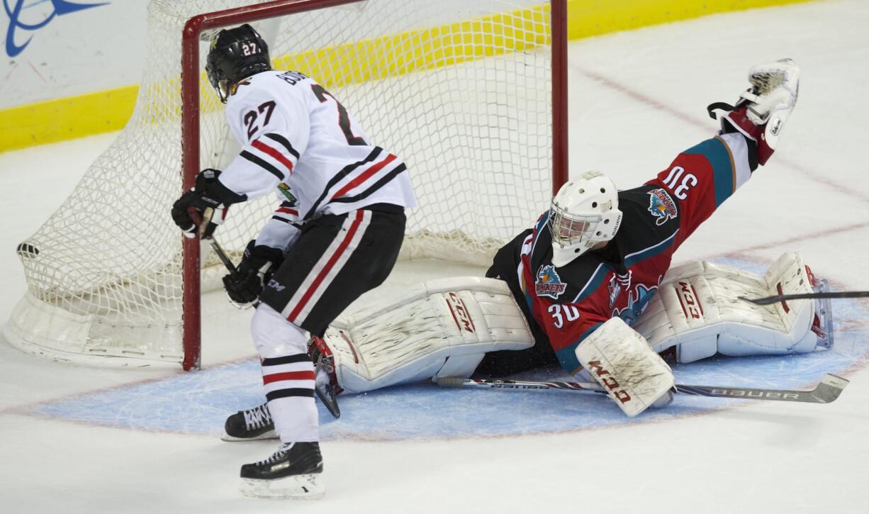 Portland's Oliver Bjorkstrand scores against Kelowna goalie Jordan Cooke in the Winterhawks' 5-1 victory.