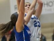 Clark College's Brooke Bowen shoots against Blue Mountain Community College in the championship game of the 2013 Women's Basketball Crossover Tournament at Clark College, Sunday, December 22, 2013. Clark won 77-72.