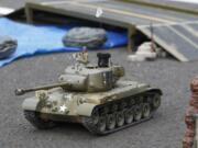 A remote control tank heads into battle at the Veterans Museum on Saturday.