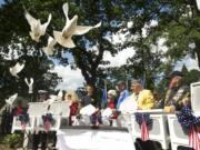 White doves are released Monday in memory of those who died in the line of duty, including Air Force Capt. Chris Stover, during an observance at the Clark County Veterans War Memorial. Stover died Jan. 7 when his helicopter crashed in England during training.