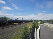 An oil train passes the Vancouver Land Bridge on Tuesday.