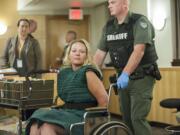 Jessica Farias, 33, of Vancouver makes a first appearance Tuesday in Clark County Superior Court. Farias is accused of driving erratically through Hazel Dell on Monday morning and then reaching for a deputy's gun, causing it to fire, while resisting arrest.