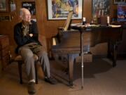 Composer Matt Doran, 92, sits at his piano inside his Hazel Dell home.