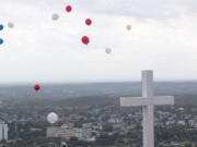 Balloons are released into the sky after a blessing by Pope Francis, from the pilgrimage site Hill of the Cross, over looking Holguin, Cuba, Monday, Sept. 21, 2015. Francis traveled to Cuba's fourth-largest city, Holguin, to celebrate a Mass at the Plaza of the Revolution, and visit the pilgrimage site, before heading to Santiago de Cuba.