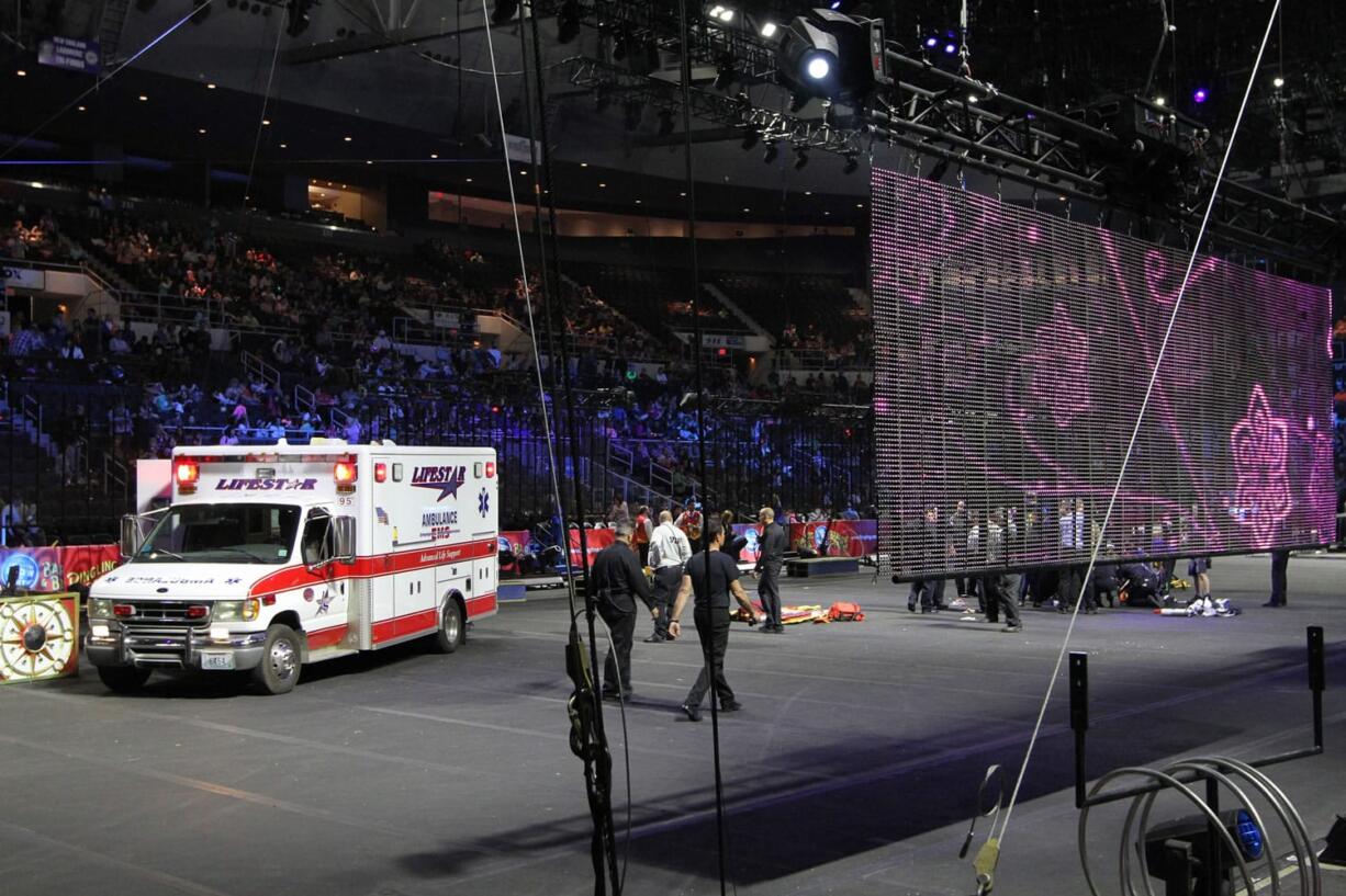 First responders work at the center ring after a platform collapsed during an aerial hair-hanging stunt at the Ringling Brothers and Barnum and Bailey Circus on Sunday in Providence, R.I.