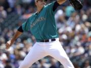 Seattle Mariners starting pitcher Chris Young throws against the Los Angeles Angels in the first inning of a baseball game Monday, May 26, 2014, in Seattle.