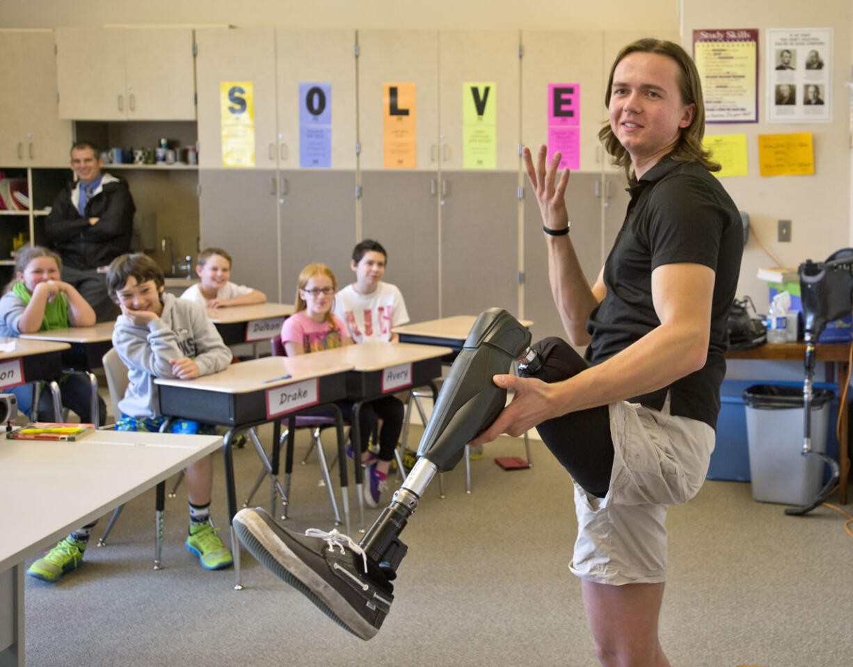 Edward Lychik talks to fifth- and sixth-graders at Maplewood Elementary School in Puyallup on April 9.