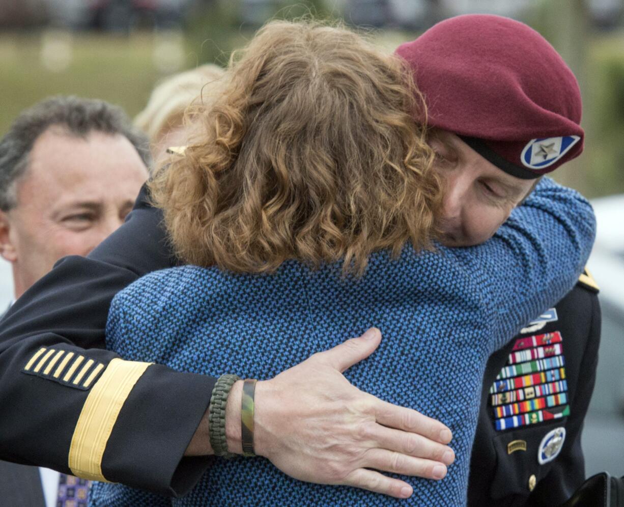 Brig. Gen. Jeffrey Sinclair embraces his defense attorney Ellen C. Brotman on Monday outside the Fort Bragg, N.C.