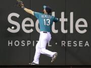 Seattle Mariners left fielder Dustin Ackley can't catch an RBI double hit by Houston's Matt Dominguez.