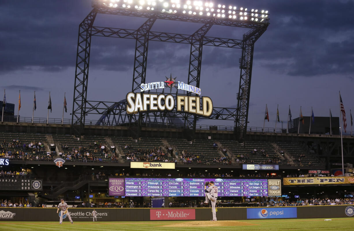 Houston Astros starting pitcher Collin McHugh begins his windup in the second inning against the Seattle Mariners, Tuesday in Seattle.