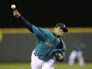 Seattle Mariners starting pitcher Felix Hernandez throws against the Oakland Athletics in the sixth inning Friday.