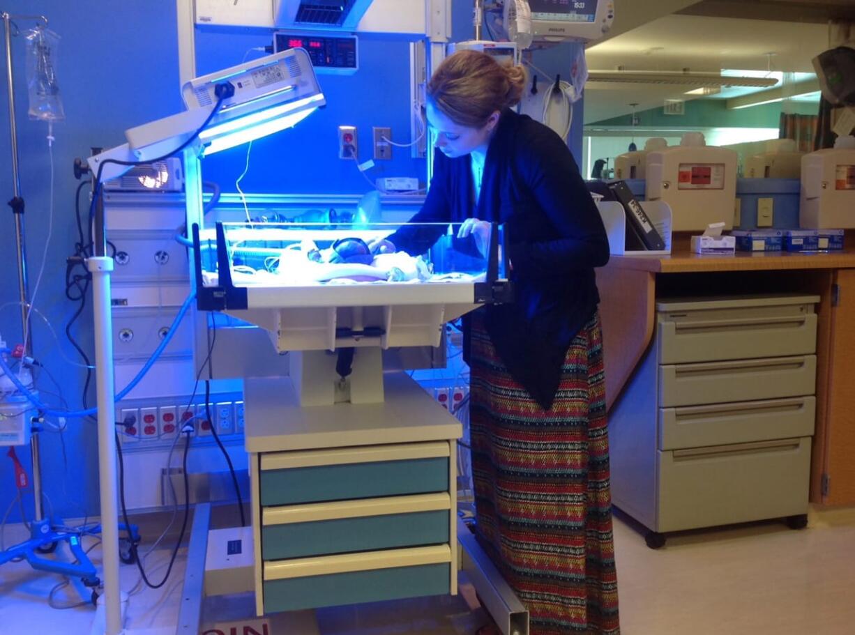 Erica Steadman checks on her daughter, Evelyn, in the neonatal intensive care unit at the University of Chicago's Comer Children's Hospital in August 2013 shortly after the baby's birth.