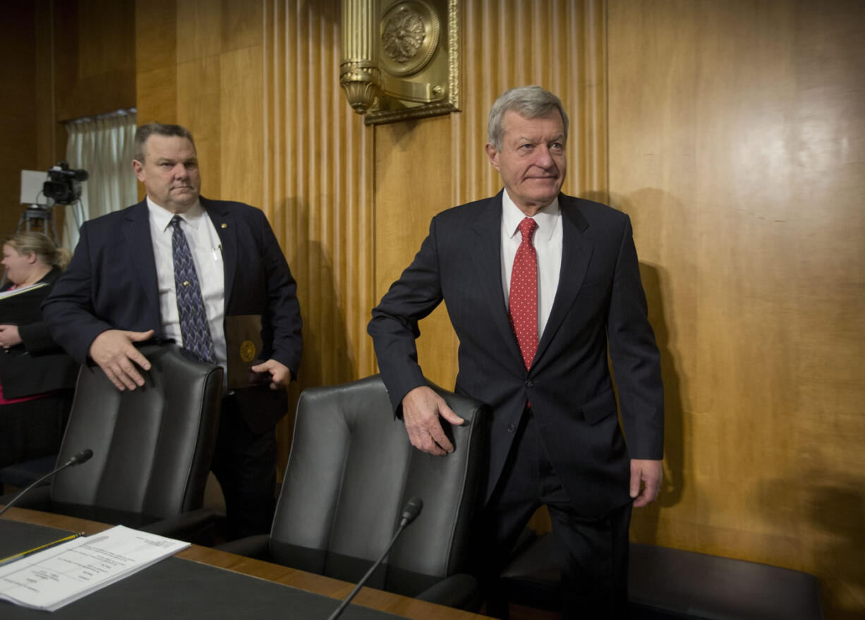 Retiring Montana Sen. Max Baucus, right, followed by Sen.