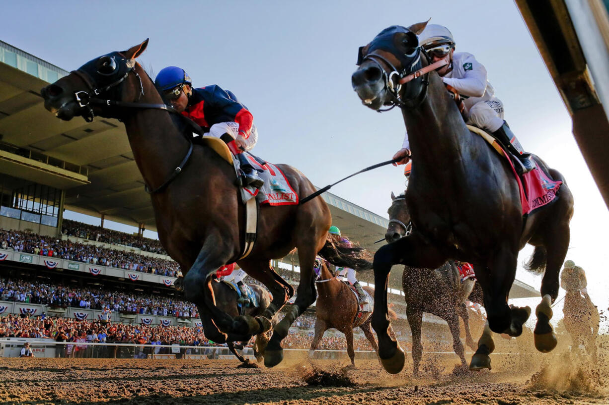 Tonalist, left, with Joel Rosario up edges out Commissioner with Javier Castellano up to win the 146th running of the Belmont Stakes on Saturday.