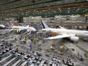 A line of Boeing 787 jets sitting on the floor nearing completion at the company's production plant in Everett.