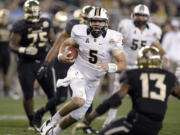 Central Florida quarterback Blake Bortles (5) dashes for a rushing touchdown as Baylor safety Terrell Burt (13) defends during the second half of the Fiesta Bowl NCAA college football game, Wednesday, Jan. 1, 2014, in Glendale, Ariz.