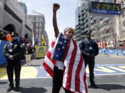 Meb Keflezighi, of San Diego, Calif., celebrates his victory in the 118th Boston Marathon, Monday, April 21, 2014, in Boston.(AP Photo/Elise Amendola)