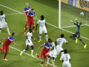 United States' John Brooks, second from left, scores his side's second goal during the group G World Cup soccer match between Ghana and the United States at the Arena das Dunas in Natal, Brazil, Monday.