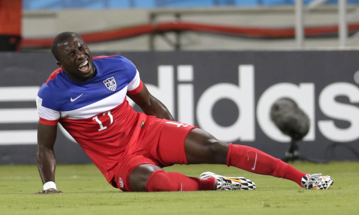 United States' Jozy Altidore grimaces after pulling up injured during the group G World Cup soccer match between Ghana and the United States at the Arena das Dunas in Natal, Brazil, Monday.