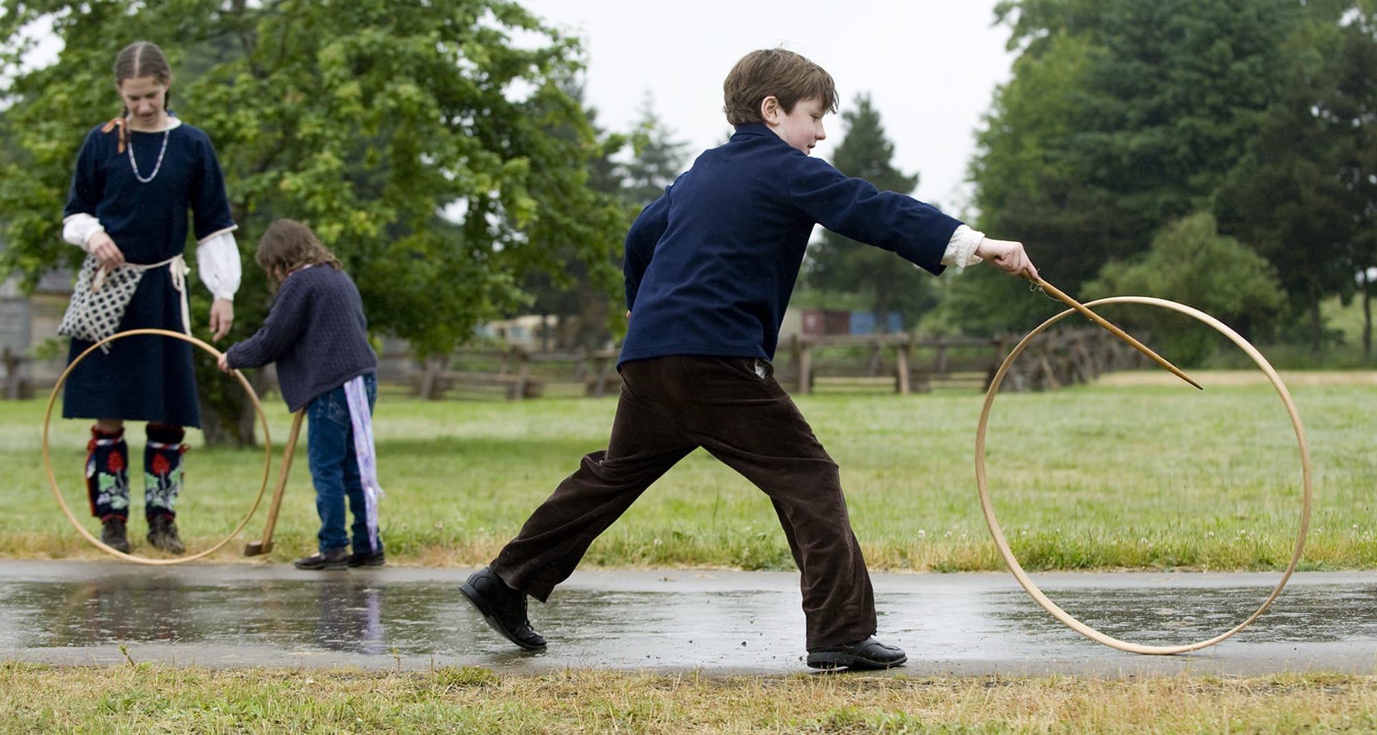 Brigade encampment re-enactor Andrew Douglas of Vancouver plays with a hoop and stick at the Fort Vancouver National Historic Site.