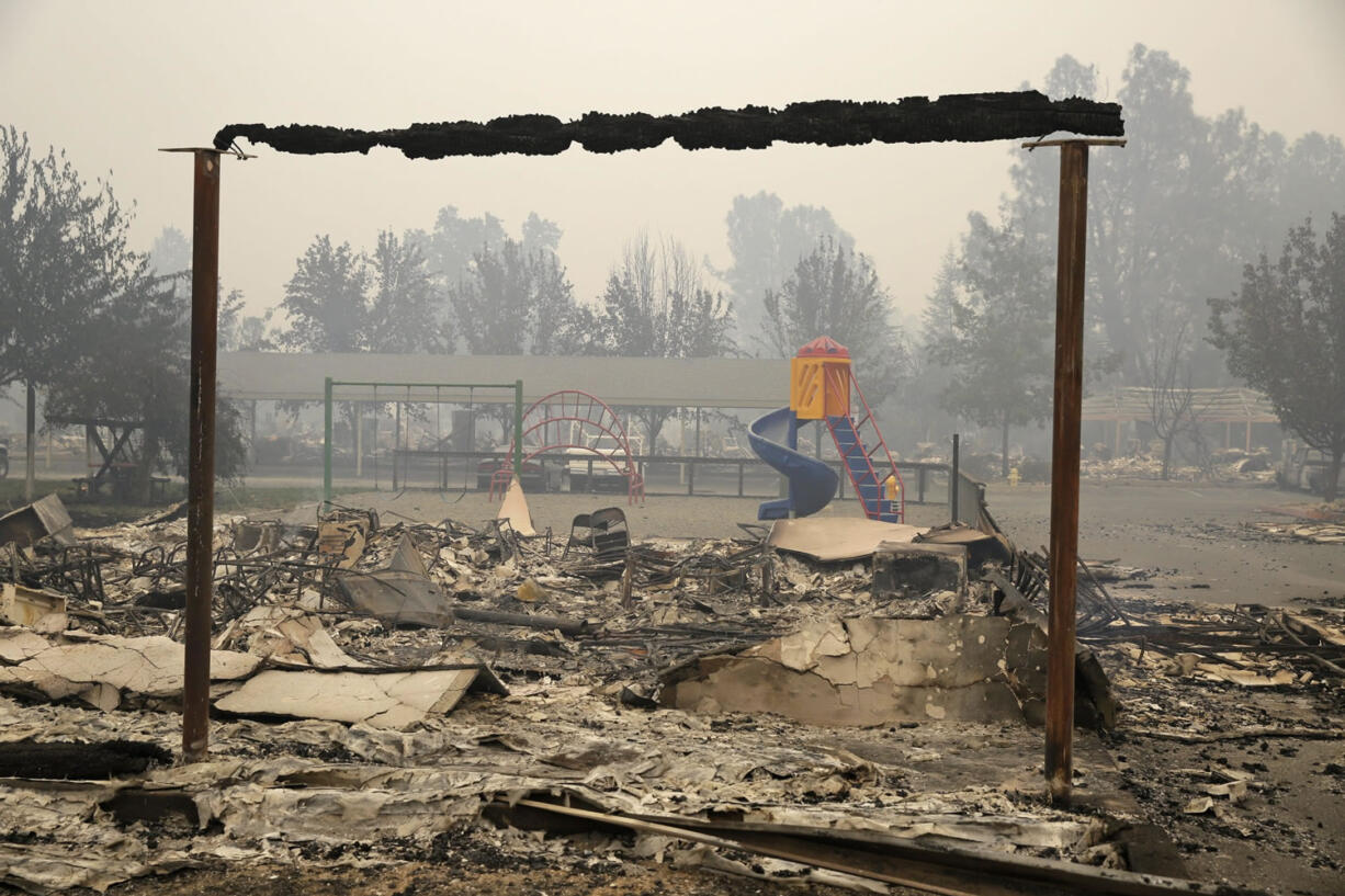 Pieces of a playground still stand at an apartment complex destroyed by fire Sunday, Sept. 13, 2015, in Middletown, Calif. California Gov. Jerry Brown has declared a state of emergency in Lake and Napa Counties after a wildfire charred more than 60 square miles within 12 hours, prompting thousands to flee their homes. Brown said Sunday the declaration will expedite debris removal and waive fees to people who need to replace official documents lost in the fire.  The blaze, about 100 miles north of San Francisco, has destroyed an unconfirmed number of homes and other buildings and damaged highways and other infrastructure.