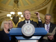 Senate Minority Leader Harry Reid of Nevada, center, speaks to reporters on Capitol Hill in Washington on Wednesday. Joining Reid from left are Sen. Patty Murray, D-Wash., Senate Minority Whip Richard Durbin of Ill.,  left, and Sen. Charles Schumer, D-N.Y., right.