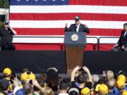 Vice President Joe Biden, center, speaks to a crowd with United Steelworkers President Leo Gerard, left, and AFL-CIO President Rich Trumka, right, before he joins joins in the annual Labor Day parade on Monday  in Pittsburgh.