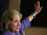 Democratic presidential candidate Hillary Rodham Clinton speaks during a campaign stop at Uncle Nancy's Coffee House in Newton, Iowa. After spending the first few months of her campaign bemoaning &quot;secret, unaccountable money&quot; in politics, Clinton is coming out Tuesday, Sept. 8, with proposals to roll back the effects of the landmark Supreme Court case governing campaign finance won by conservative activist group Citizens United.