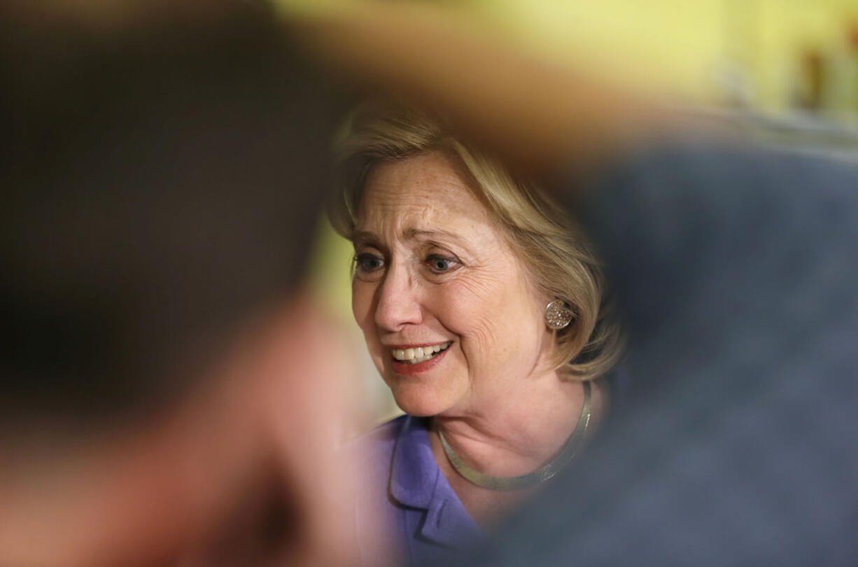 Democratic presidential candidate Hillary Rodham Clinton greets supporters during a campaign stop at Uncle Nancy's Coffee House on Sunday in Newton, Iowa.