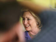 Democratic presidential candidate Hillary Rodham Clinton greets supporters during a campaign stop at Uncle Nancy's Coffee House on Sunday in Newton, Iowa.