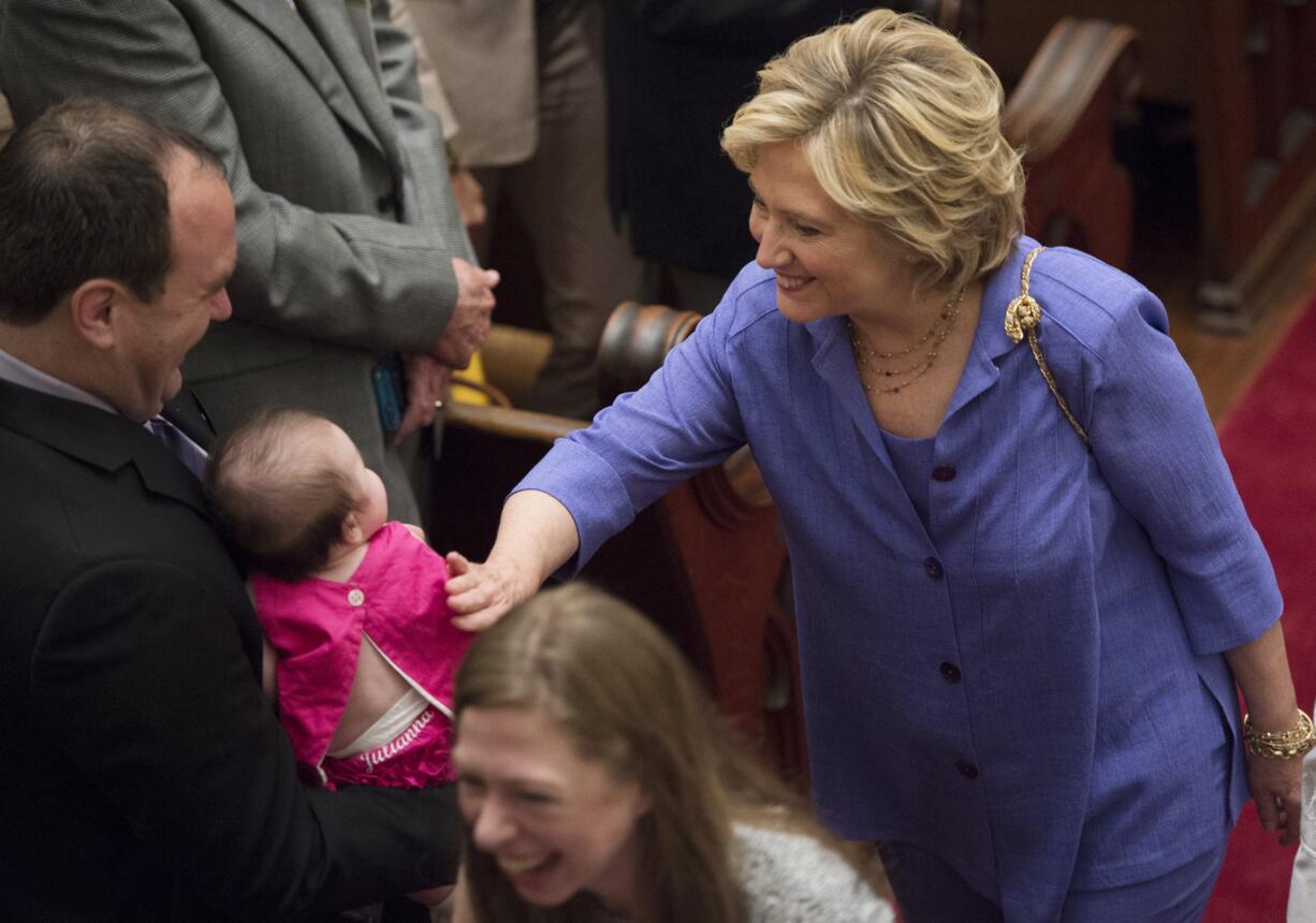 Democratic presidential candidate Hillary Rodham Clinton, right, and her daughter, Chelsea, greet congregants after attending the Foundry United Methodist Church for their Bicentennial Homecoming Celebration in Washington on Sunday.