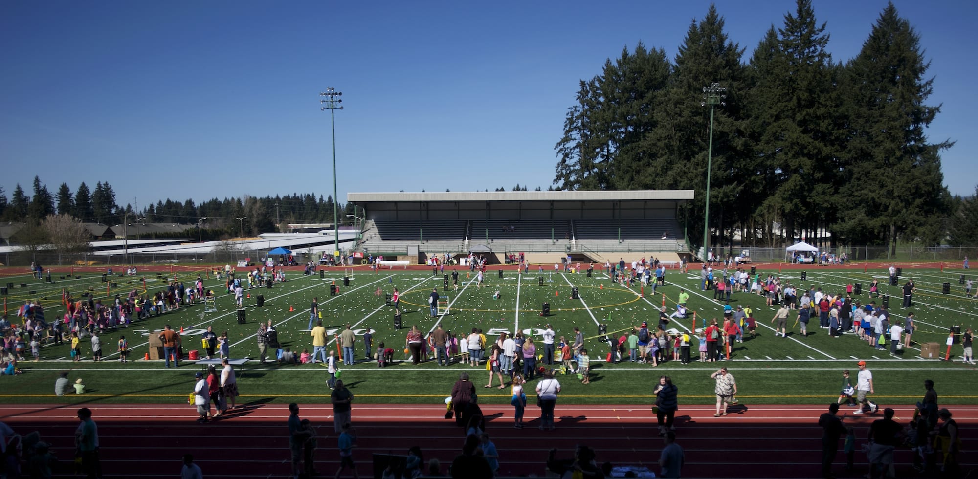 A second ground of children join approximately 800 kids, many with special needs, in an Easter Egg hunt at McKenzie Stadium in 2013.