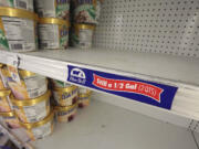 FILE - In this April 21, 2015 file photo, shelves sit empty of Blue Bell ice cream at a grocery store in Dallas afterTexas-based Blue Bell Creameries issued a voluntary recall for all of its products on the market after two samples of chocolate chip cookie dough ice cream tested positive for Listeriosis. Food manufacturers must be more vigilant about keeping their operations clean under new government safety rules released Thursday in the wake of deadly foodborne illness outbreaks linked to ice cream, caramel apples, cantaloupes and peanuts.