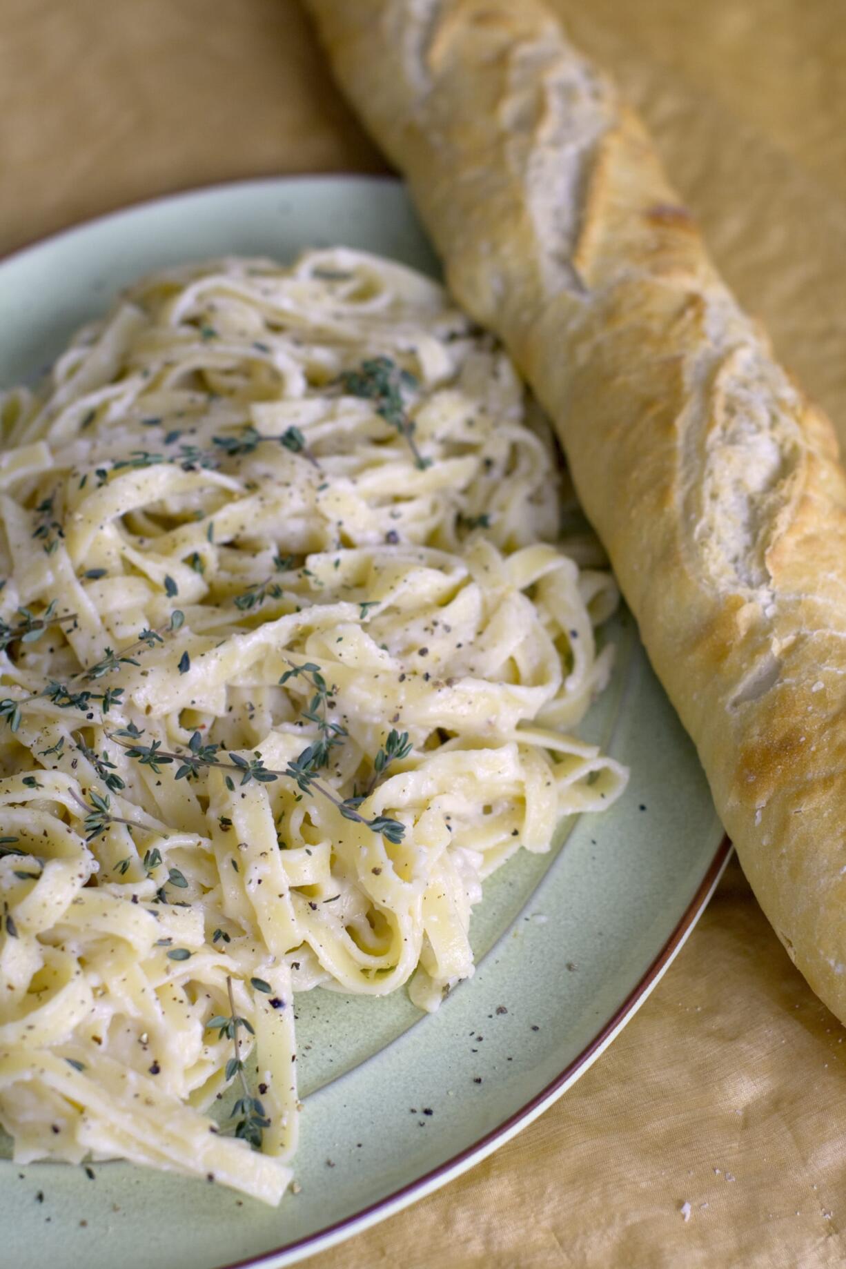 Poaching mellows the garlic's intensity but not its flavor for a tasty fettuccini with garlic parmesan puree.