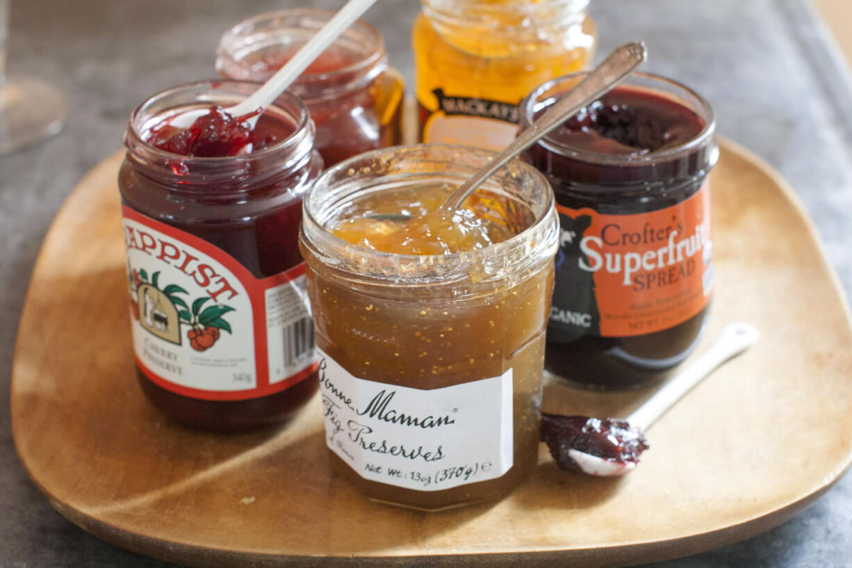 Assortment of jams from left to right, Trappist cherry preserve, Bonne Maman fig preserves, Mackays dundee orange marmalade and Crofter's superfruit.