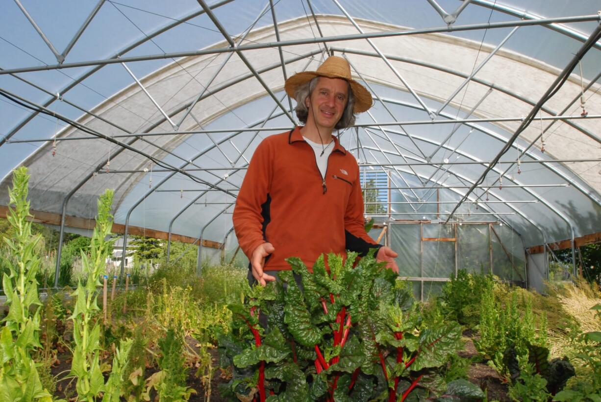 Chuck Burr stands with some red chard at his organic seed farm Monday outside Ashland, Ore.