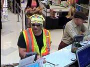 The Clark County Sheriff's Office is asking for the public's help in finding this man (in the vest), who reportedly came to the Bank of America branch at the Albertsons on 14300 N.E. 20th Ave. and presented the teller with a note demanding money. The man left empty-handed, and no one was hurt.