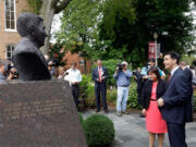 Republican presidential candidate, Wisconsin Gov. Scott Walker, right, and his wife Tonette, admire a bust of former president Ronald Reagan, in the Ronald Reagan Peace Garden, after speaking at Eureka College during a campaign stop, Thursday, Sept. 10, 2015, in Eureka, Ill.