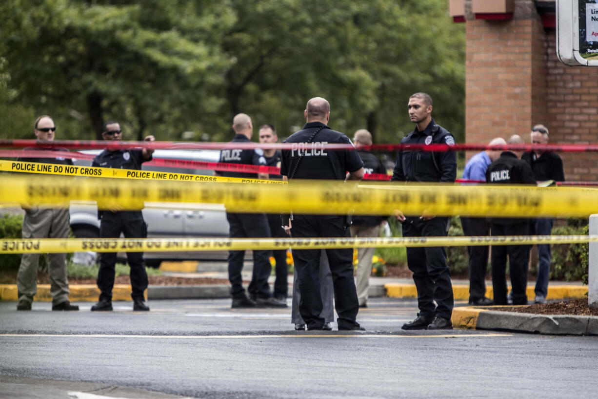 Kent police work at the scene of the double homicide at Wendy's in Kent on Wednesday.